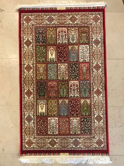 null Modern Turkish carpet with a wide border decorated with geometric figures and...