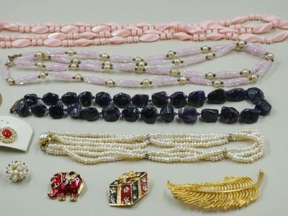 null Lot of costume jewelry including necklaces, brooches, earrings and a pendan...