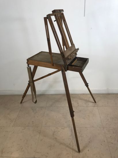 null Wooden folding easel for travel. Fabric shoulder strap and painted metal carrying...