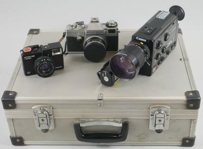 null Case containing a Canon Super 8 sound camera, a Praktica camera. Optima 535...