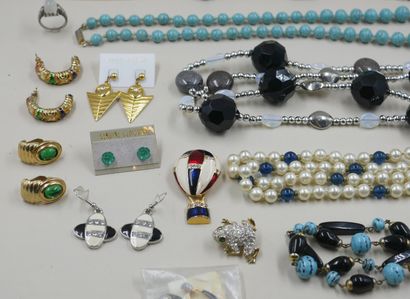 null Lot of costume jewelry including necklaces, brooches, earrings and a ring.