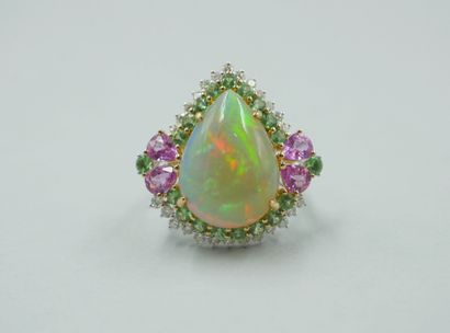 null 18k white gold ring surmounted by a cabochon-cut pear-shaped opal of 8cts approximately...