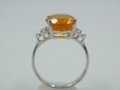 null Ring in 18k white gold with an oval fire opal of 3.50cts and six diamonds. 

PB...