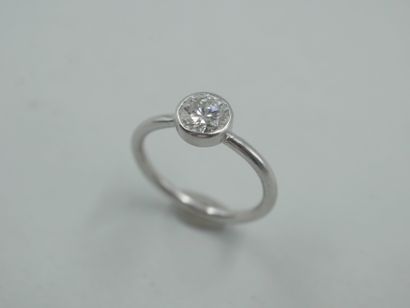 null 
18k white gold ring centered with a 0.79ct E color diamond, SI1 in a closed...