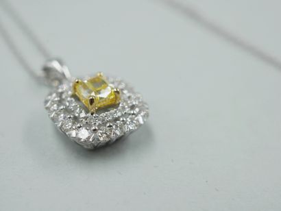 null 18k white gold pendant centered with a cushion-cut champagne diamond of about...