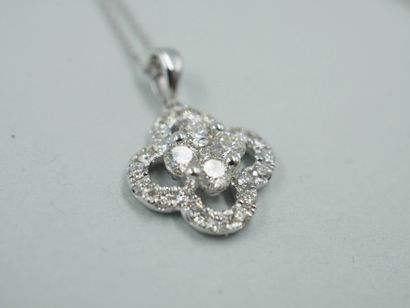 null Openwork clover pendant in 18k white gold set in its center with a pavement...
