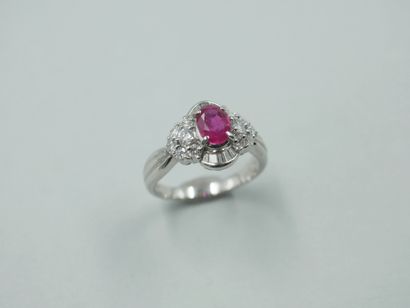 null 
Platinum ring set with an oval ruby of 1ct approximately accosted with flowers...