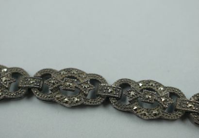 null Silver bracelet with openwork oblong links, decorated with cut marcasites. 

Work...