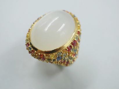 null Gold vermeil ring centered on a large oval cabochon moonstone in a paved surround...