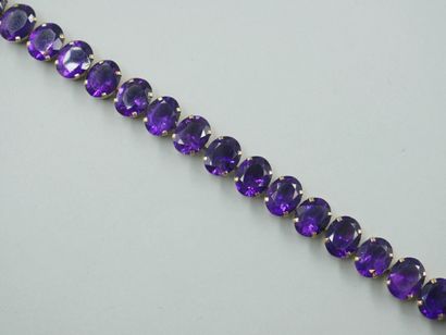 null Bracelet in 14k yellow gold set with 21 oval amethysts in claw setting.

PB...