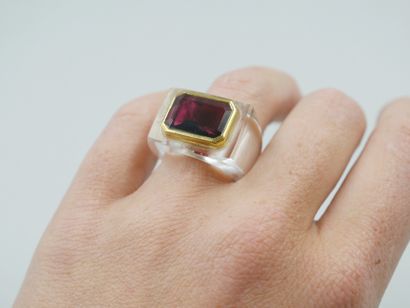 null Ring with cut crystal setting set with an emerald-cut rhodolite of about 8cts...