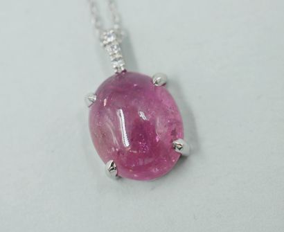null Pendant in 18k white gold set with a pink tourmaline cabochon of 4cts, the hoop...