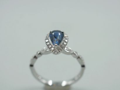 null 18k white gold ring set with a 1ct natural pear cut sapphire in a diamond setting....