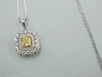 null 18k white gold pendant centered with a cushion-cut champagne diamond of about...