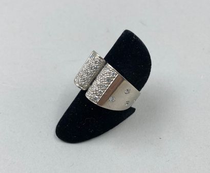 null Bridge ring in 18k white gold, the upper part paved with diamonds, the ring...