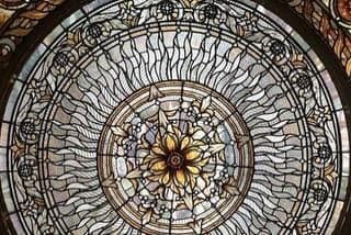 null Stained glass dome decorated at the top with a central medallion with a radiating...