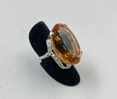 null 
Important ring in platinum decorated with an exceptional oval citrine of 50cts...