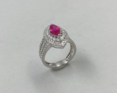 null 18k white gold navette ring surmounted by a 0.90ct ruby surrounded by a double...