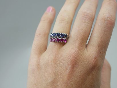 null Two 18k white gold garter rings set with five rubies on one and five sapphires...