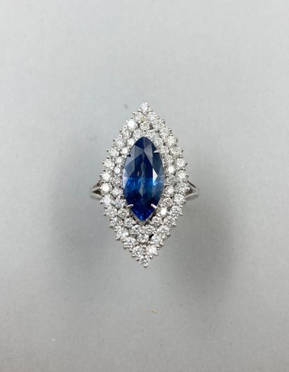 null 14k white gold marquise ring set with a 5ct navette cut sapphire surrounded...