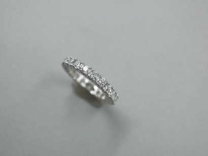 null American wedding band in 18k white gold set with 22 diamonds in F to G color...