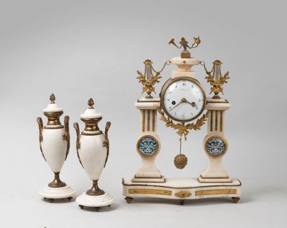 null Portico clock in white marble and gilt bronze. The white enamelled dial with...