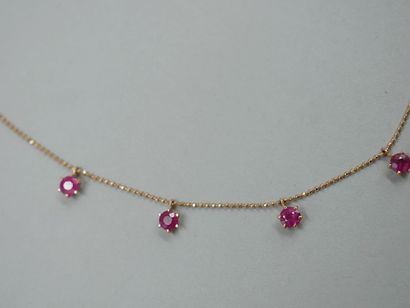 null Necklace in 18k yellow gold with seven rubies in a claw setting for about 3cts....