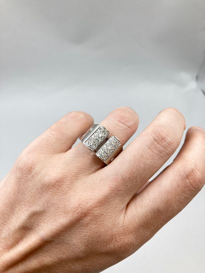 null Bridge ring in 18k white gold, the upper part paved with diamonds, the ring...