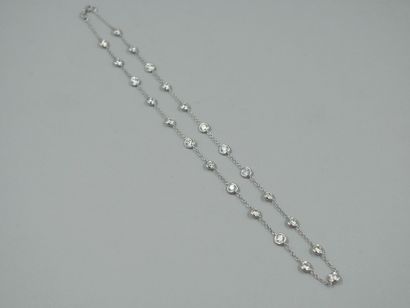 null Necklace in 18k white gold with 23 brilliant-cut diamonds in closed setting....