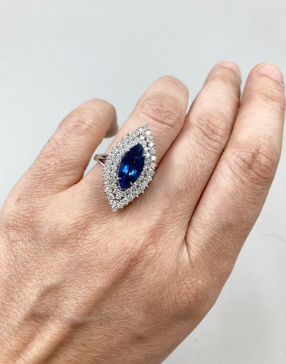 null 14k white gold marquise ring set with a 5ct navette cut sapphire surrounded...