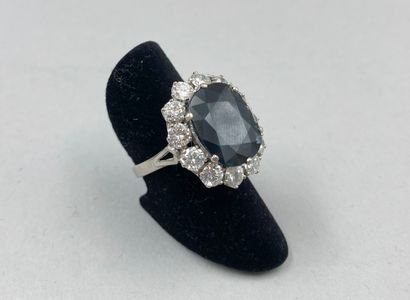 null 18k white gold pompadour ring set with a large sapphire of about 8cts in a setting...