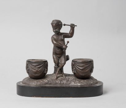 null Inkwell in bronze with brown patina representing a faun playing the drum. 

Base...