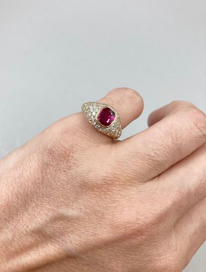 null Ring in 18k yellow gold set with a beautiful ruby in a diamond setting.

PB...