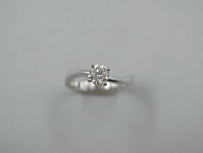 null Solitaire ring in 18k white gold with movement topped by a 0.70cts diamond of...