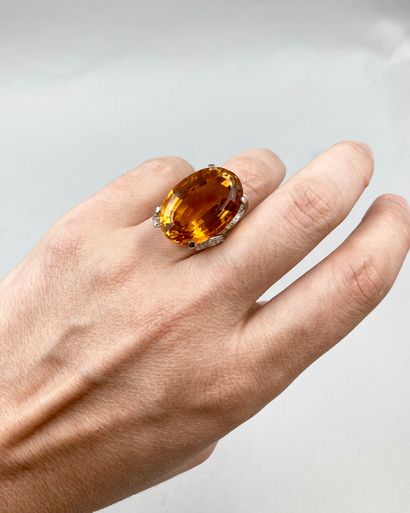 null 
Important ring in platinum decorated with an exceptional oval citrine of 50cts...