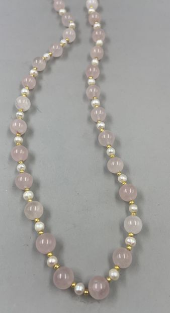 null Long necklace of pink quartz balls interspersed with freshwater pearls and golden...