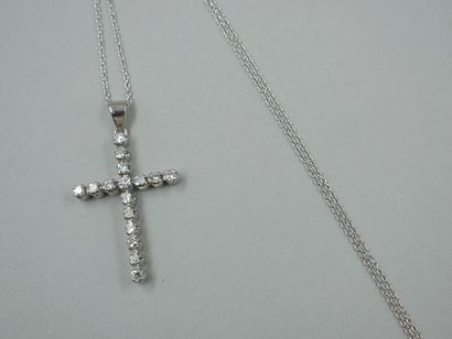 null Cross pendant in 14k white gold set with diamonds for 0.50cts approximately....