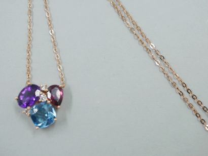 null Necklace in 18k gold set with a cushion-cut blue topaz, an oval amethyst and...