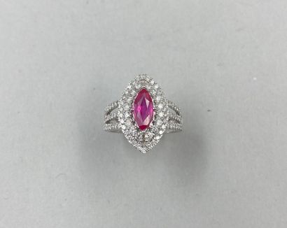 null 18k white gold navette ring surmounted by a 0.90ct ruby surrounded by a double...