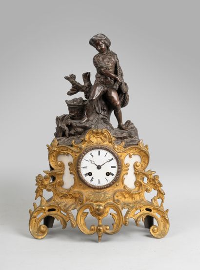 null Clock in bronze, gilt metal and white marble. The dial inscribed in interlacing...