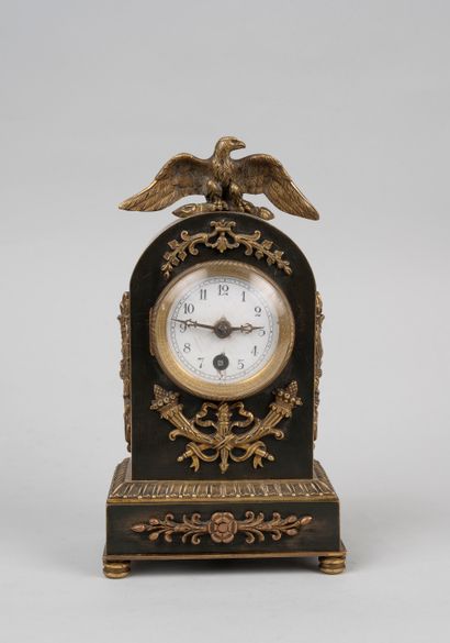 null Bronze clock with double patina, with applied decorations of horns of plenty,...