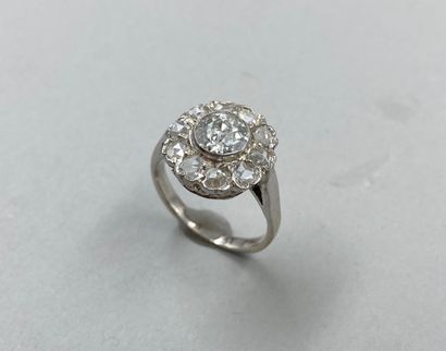 null 18k white gold flower ring centered on a 1ct old cut diamond in a diamond setting....