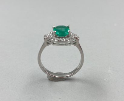 null Art Deco style ring in 18k white gold set with a 1ct oval emerald in a diamond...