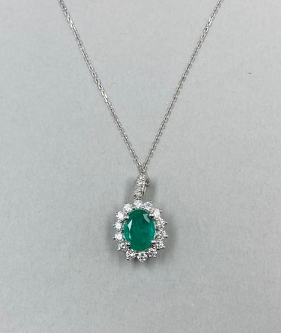 null 18k white gold Pompadour pendant set with an oval emerald of about 1.40ct in...
