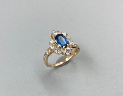 null 18k yellow gold ring centered on an oval sapphire of about 2ct surrounded by...