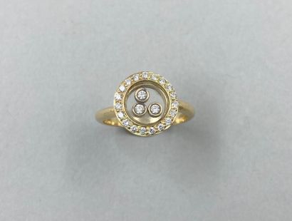 null 18k yellow gold ring with three mobile diamonds in a diamond setting in the...