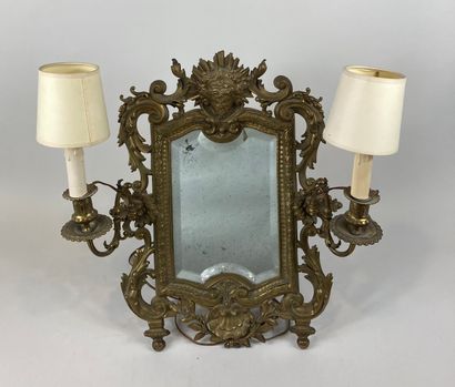 null Bevelled table mirror forming a reflector with double gilt bronze light arms....