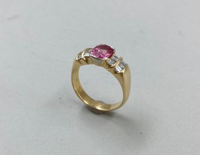 null 18k yellow gold ring set with a pink sapphire of about 2cts in closed setting...