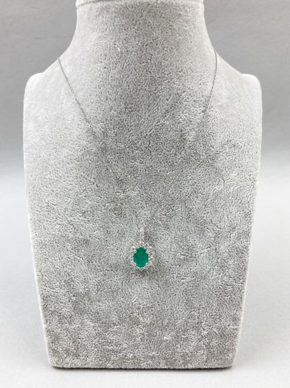 null 18k white gold Pompadour pendant set with an oval emerald of about 1.40ct in...