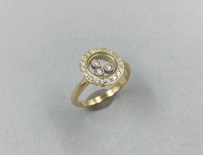 null 18k yellow gold ring with three mobile diamonds in a diamond setting in the...